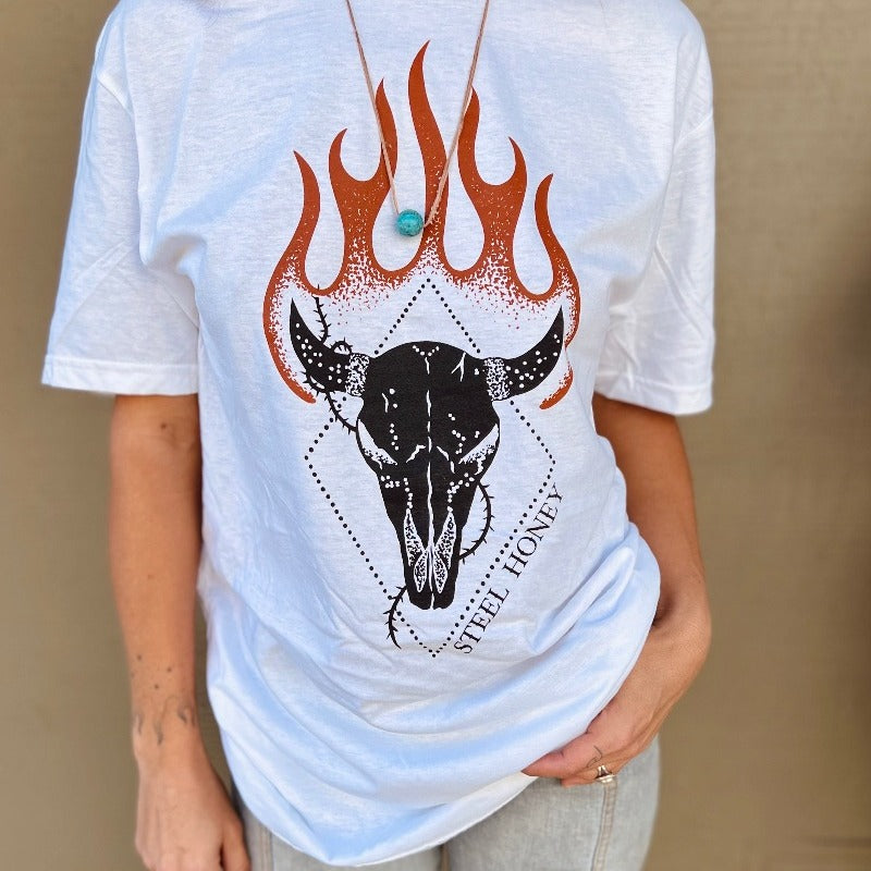 cropped image of a model wearing a white t-shirt. the steel honey logo design is front and center. Black with orange flames